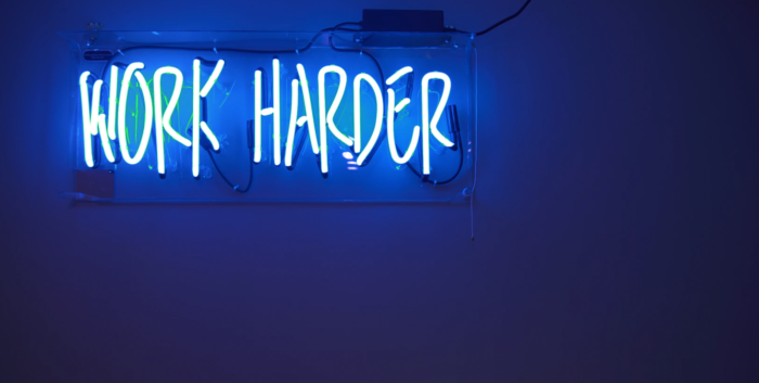 A sign saying "work harder."
